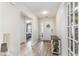 Inviting entryway featuring wood-look flooring, white walls, and views of the home's interior and front door at 688 Tattlesbury Dr., Conway, SC 29526