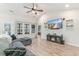 Inviting living room with luxury vinyl floors, media center and large windows for ample light at 688 Tattlesbury Dr., Conway, SC 29526
