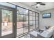 Relaxing sunroom complete with comfortable seating, TV, and views of the backyard at 688 Tattlesbury Dr., Conway, SC 29526