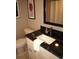 Bathroom with dark granite countertop and sink at 6900 N Ocean Blvd. # 111, Myrtle Beach, SC 29572