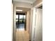 A hallway with tile floors, leading to the kitchen and bedrooms at 6900 N Ocean Blvd. # 111, Myrtle Beach, SC 29572