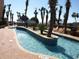 Outdoor lazy river with palm trees and seating at 6900 N Ocean Blvd. # 111, Myrtle Beach, SC 29572