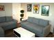 Living room with two gray couches and coffee table at 6900 N Ocean Blvd. # 111, Myrtle Beach, SC 29572