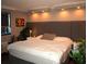 Main bedroom with king-size bed, recessed lighting and artwork at 6900 N Ocean Blvd. # 111, Myrtle Beach, SC 29572