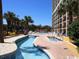 Resort-style pool area with lazy river and hot tubs at 6900 N Ocean Blvd. # 111, Myrtle Beach, SC 29572