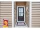 Front door entry with a welcome mat and house number at 763 Eastridge Dr., Conway, SC 29526