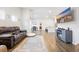 Living room with fireplace, hardwood floors, and sectional sofa at 763 Eastridge Dr., Conway, SC 29526