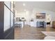 Open living space with kitchen, fireplace, and hardwood floors at 763 Eastridge Dr., Conway, SC 29526