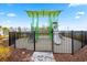 Community playground with climbing structures and slide, enclosed by a black metal fence at 763 Eastridge Dr., Conway, SC 29526