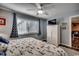 King-size bed, dresser, and ceiling fan in bedroom at 9661 Shore Dr. # 4B-15, Myrtle Beach, SC 29572