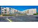 Exterior view of condo building with parking and pool at 9661 Shore Dr. # 4B-15, Myrtle Beach, SC 29572