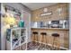 Beach-themed kitchen with breakfast bar and stools at 9661 Shore Dr. # 4B-15, Myrtle Beach, SC 29572