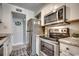Kitchen with stainless steel appliances and light cabinets at 9661 Shore Dr. # 4B-15, Myrtle Beach, SC 29572