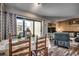 Living room features casual seating, dining table, and access to deck at 9661 Shore Dr. # 4B-15, Myrtle Beach, SC 29572