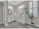 Modern bathroom with double vanity, a large mirror and a walk-in shower at 1208 Maxwell Dr., Little River, SC 29566