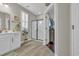 Bathroom with double vanity, walk-in shower, and elegant tile flooring at 1208 Maxwell Dr., Little River, SC 29566