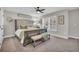 Elegant Primary bedroom with a tufted headboard and bench at 1208 Maxwell Dr., Little River, SC 29566