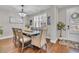 Dining room with wood table, chairs, and hardwood floors at 1208 Maxwell Dr., Little River, SC 29566