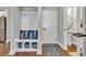 Charming entryway with built-in bench, storage, and a powder room at 1208 Maxwell Dr., Little River, SC 29566