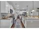 Modern kitchen with white cabinets, granite countertops and stainless steel appliances at 1208 Maxwell Dr., Little River, SC 29566