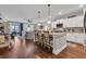 Modern kitchen with white cabinets, granite counters, and island at 1208 Maxwell Dr., Little River, SC 29566