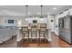Eat-in kitchen with island, white cabinets, and stainless steel appliances at 1208 Maxwell Dr., Little River, SC 29566