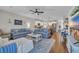 Open concept living room showcasing kitchen and hardwood floors at 1208 Maxwell Dr., Little River, SC 29566