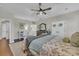Main bedroom with king bed, private ensuite, and home office area at 1208 Maxwell Dr., Little River, SC 29566
