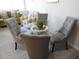 Dining area with glass table and four grey chairs at 1210 Benna Dr. # B, Myrtle Beach, SC 29577