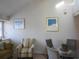 Dining area with glass table and four grey chairs at 1210 Benna Dr. # B, Myrtle Beach, SC 29577