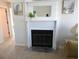 Living room with white fireplace and decorative mantle at 1210 Benna Dr. # B, Myrtle Beach, SC 29577