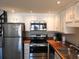 Updated kitchen featuring white cabinets and a corner sink at 1210 Benna Dr. # B, Myrtle Beach, SC 29577