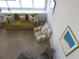 Living room with a green couch, striped armchair, and window seat at 1210 Benna Dr. # B, Myrtle Beach, SC 29577