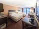 Spacious bedroom with two queen beds and balcony access at 1501 S Ocean Blvd. # 516, Myrtle Beach, SC 29577