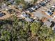 Aerial view showing landscaped lawns, mature trees, fenced backyards, and backyard swimming pools at 160 Maggie Way, Myrtle Beach, SC 29588