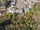 Overhead view of a landscaped backyard with a patio, mature trees, and small swimming pool at 160 Maggie Way, Myrtle Beach, SC 29588