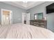 Spacious bedroom featuring a comfortable bed, dresser, and ample natural light, creating a relaxing atmosphere at 160 Maggie Way, Myrtle Beach, SC 29588