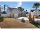 Exterior view of a well-maintained single-Gathering home with attached garage, paved driveway, and fenced yard at 160 Maggie Way, Myrtle Beach, SC 29588