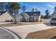 Well-maintained single-Gathering home with a landscaped front yard and a paved driveway leading to an attached garage at 160 Maggie Way, Myrtle Beach, SC 29588