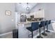 Kitchen bar with granite countertops, offering a casual dining space and seamless flow into the adjacent kitchen at 160 Maggie Way, Myrtle Beach, SC 29588