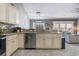 A modern kitchen with stainless steel appliances and granite countertops blends seamlessly with the adjacent living space at 160 Maggie Way, Myrtle Beach, SC 29588