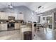 Modern kitchen with granite countertops, stainless steel appliances, and an adjacent dining area for Gathering meals at 160 Maggie Way, Myrtle Beach, SC 29588