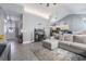 Open-concept living room with seamless flow to kitchen, neutral color palette, and view of the front entryway at 160 Maggie Way, Myrtle Beach, SC 29588