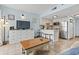 Living area with a coffee table and kitchen view at 1605 S Ocean Blvd. # 1006, Myrtle Beach, SC 29577