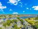Waterfront homes overlooking waterway, golf course, and boat docks from an aerial view at 1609 Harbor Dr., North Myrtle Beach, SC 29582