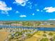 Beautiful aerial view of waterfront real estate and golf course under a blue sky at 1609 Harbor Dr., North Myrtle Beach, SC 29582