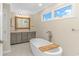 Bathroom featuring a soaking tub, dual vanity, and designer finishes at 1609 Harbor Dr., North Myrtle Beach, SC 29582