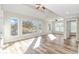 Airy bedroom with tray ceilings, hardwood floors, and large windows that bathe the room in natural light at 1609 Harbor Dr., North Myrtle Beach, SC 29582