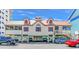 Beautiful stilted beach house with red shutters and trim and ample parking below at 1609 Harbor Dr., North Myrtle Beach, SC 29582
