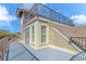 Exterior view of rooftop deck with railing, shuttered windows and light tan siding at 1609 Harbor Dr., North Myrtle Beach, SC 29582